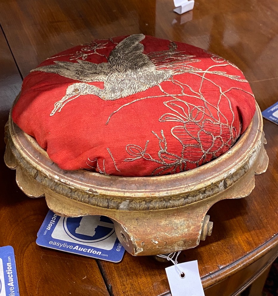 A Victorian carved giltwood footstool, diameter 32cm